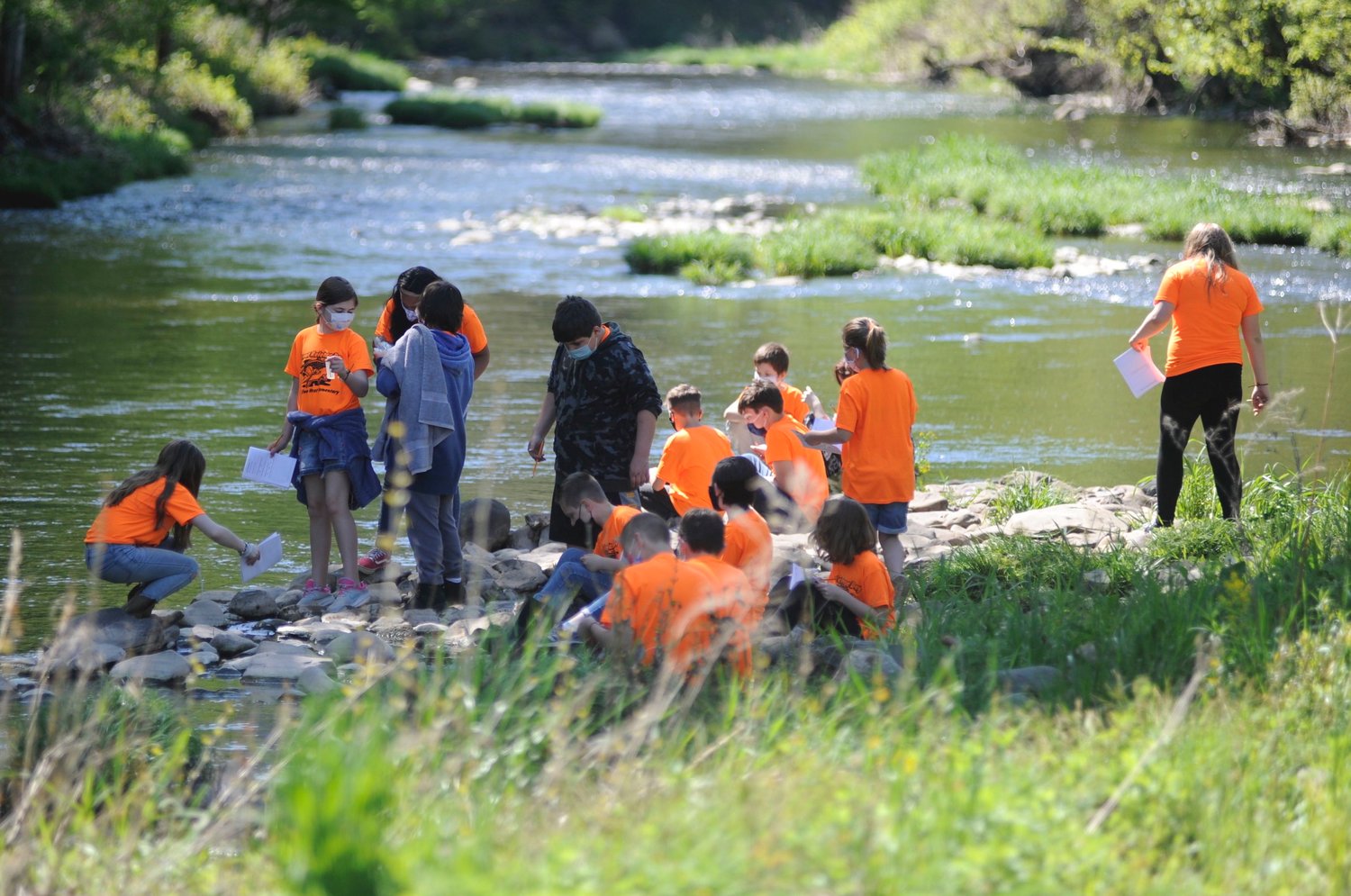 A classroom project moves into the great outdoors. Sullivan West fifth-graders record observations in their “Stream Explorer” field notebooks, as part of the Trout in the Classroom project.